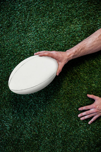 istock Cropped image of a man holding rugby ball 664206088