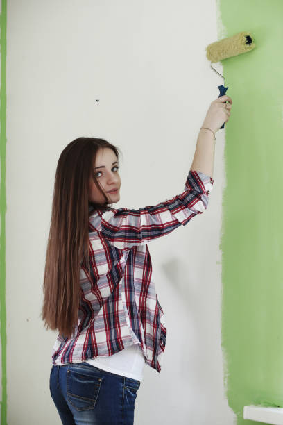 istock Girl doing repairs in the apartment 664206208