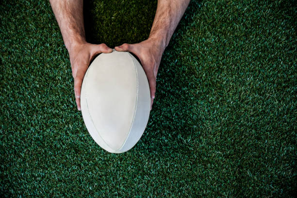 Man holding rugby ball