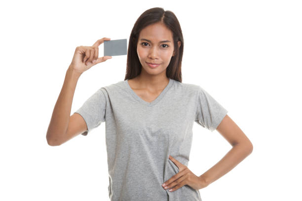istock Young Asian woman smile with a blank card. 664209472