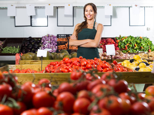 istock woman selling fresh tomatoes at market 664209628