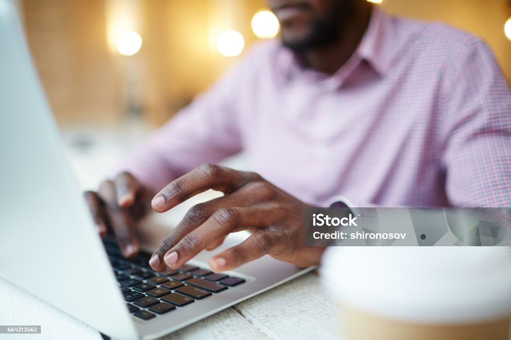 Designer typing Hands of businessman or designer typing on l aptop Accessibility Stock Photo