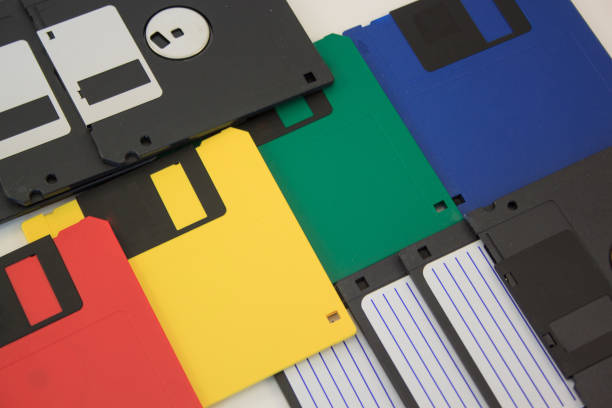 istock Group of colored floppy disks on the white background. 664218756