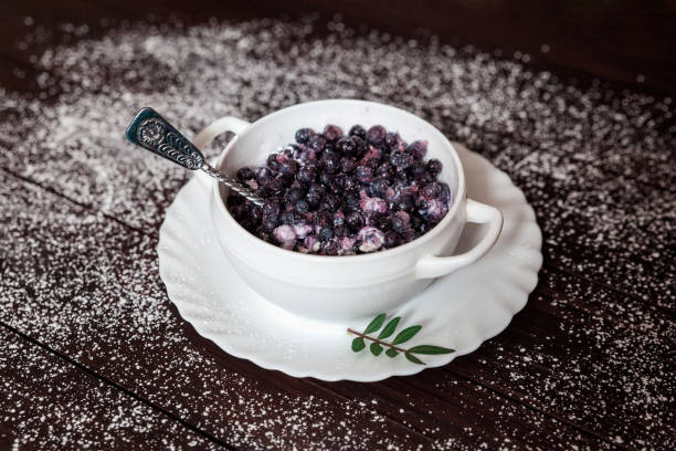 Blueberries and ice cream in the white plate