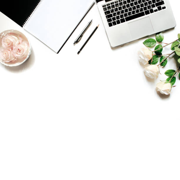 istock Modern minimalistic work place. White office desk table with laptop keyboard, pen, white roses, vintage tray. Top view with copy space, flat lay 664222102