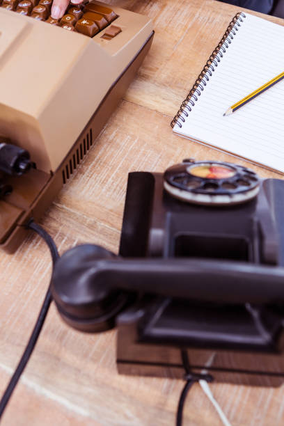 istock Above view of typewriter and old phone 664224706