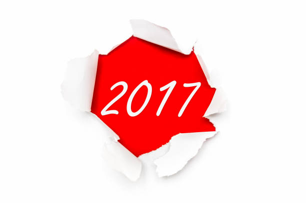 istock Torn paper with written words New Year 2017 664225946