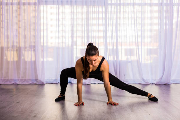 istock Woman stretching in the studio 664226580