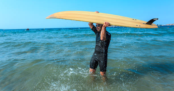 istock Surfer with sunglasses in the sea 664233442