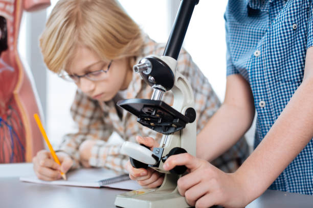 istock Careful focused young scientist noting the results 664233472