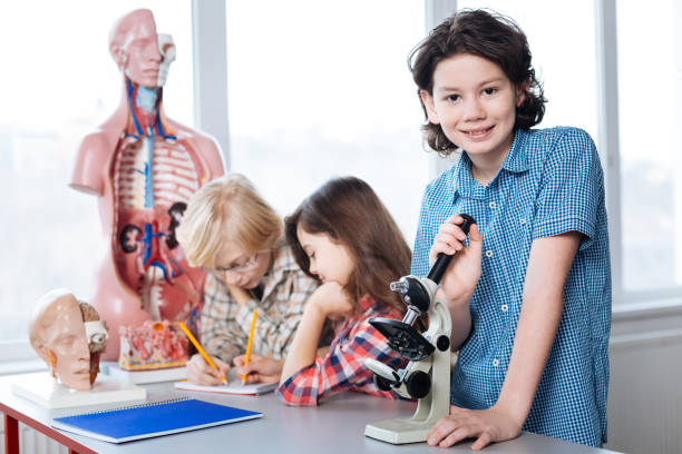 istock Charming young scientist conducting a lab research 664233988