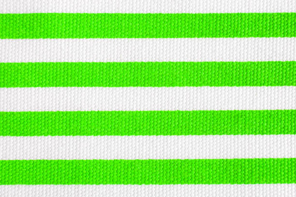 istock Textile background with green and white stripes. Fabric texture 664234352