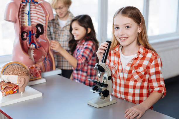istock Vibrant charismatic children passionate about science 664234836