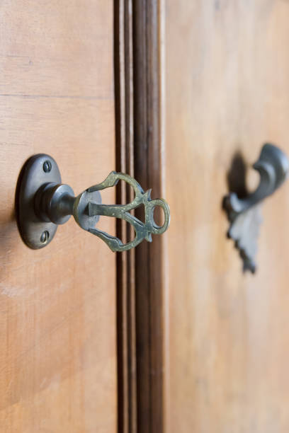 istock Vintage metal key with blurry background. 664238522