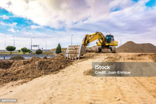 Openair Mine With Heavy Machinery Excavators For Earth And Rock Movement Stock Photo - Download Image Now