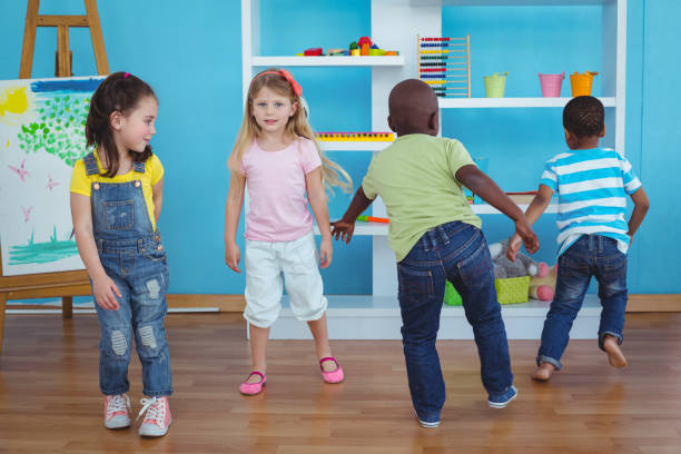 istock Happy kids playing games together 664242912