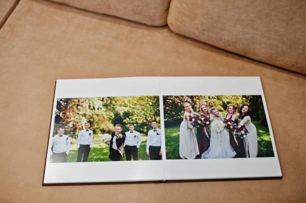 istock Two open pages of wedding book on sofa. 664245040