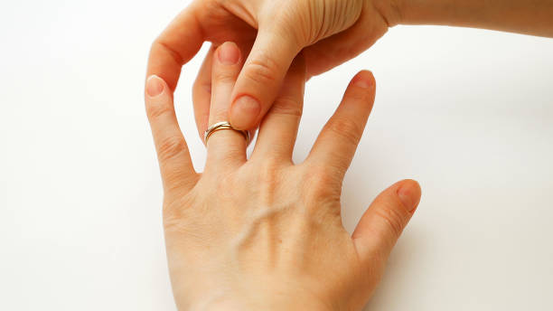 istock Woman wears engagement or wedding diamond ring 664245146
