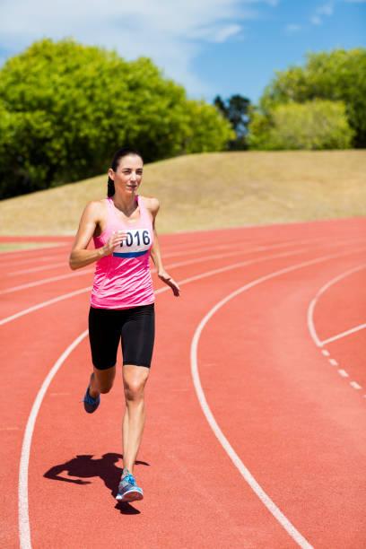 istock Female athlete running on the running track 664246676
