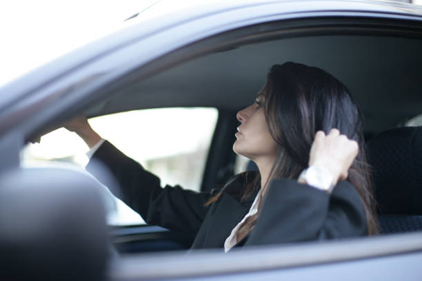 istock Young woman driving 664253654