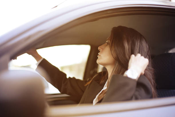 istock Young woman driving 664253706