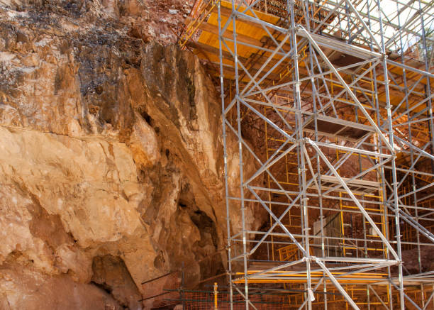 istock archaeological excavation site with soil layers, mother rock and scaffold 664255492