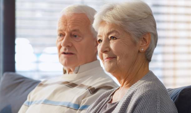 istock Senior couple watching TV 664259262