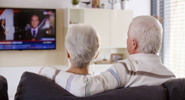 istock Senior couple watching TV 664259302