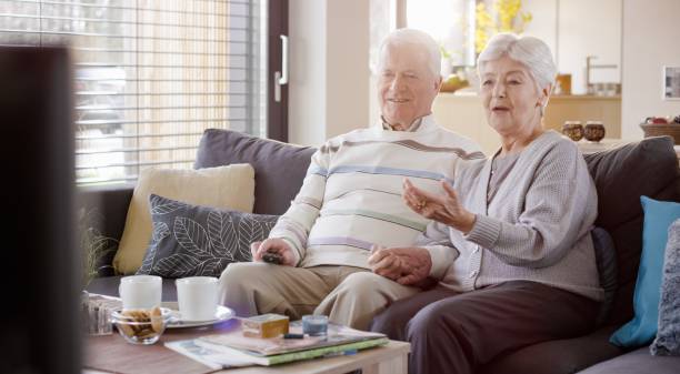 istock Senior couple watching TV 664259306