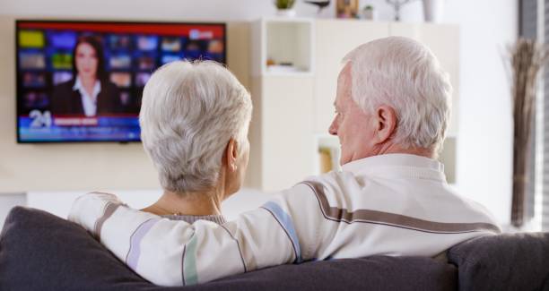 istock Senior couple watching TV 664259314