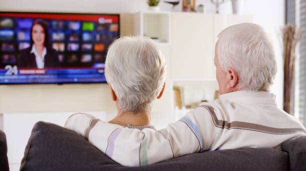 istock Senior couple watching TV 664259324