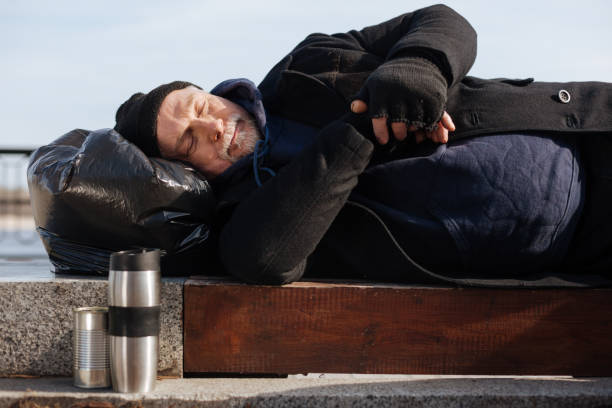 istock Calm homeless keeping hands crossed on the belly 664259430
