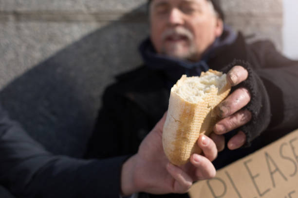 istock Close up of males hands keeping bread 664266638
