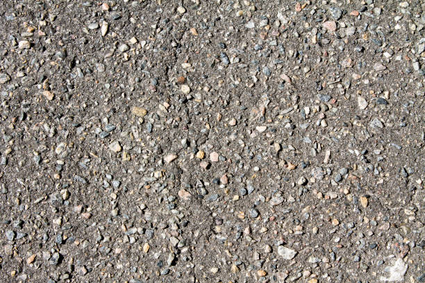 istock Old asphalt road with big grain stones 664271276