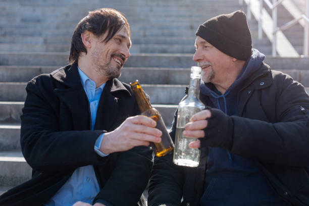 istock Positive delighted friends touching their bottles 664271600