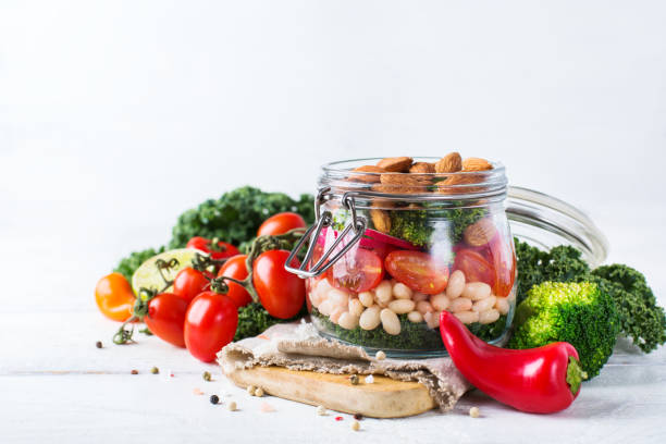 istock Healthy vegan salad in a mason jar with beans 664272416