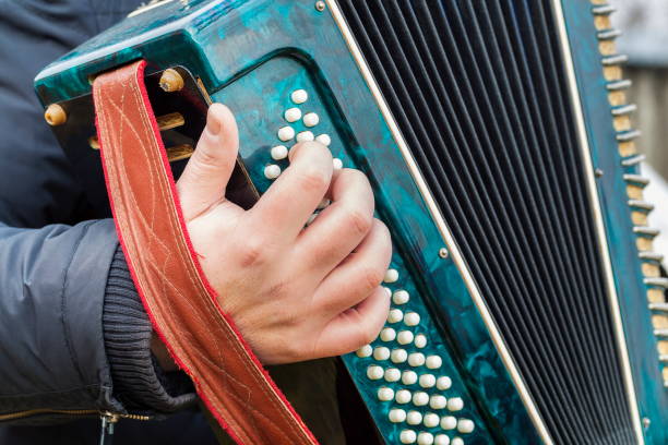 istock Man plays the accordion 664276256