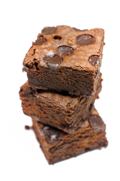 istock Chocolate brownie isolated on white background 664277580
