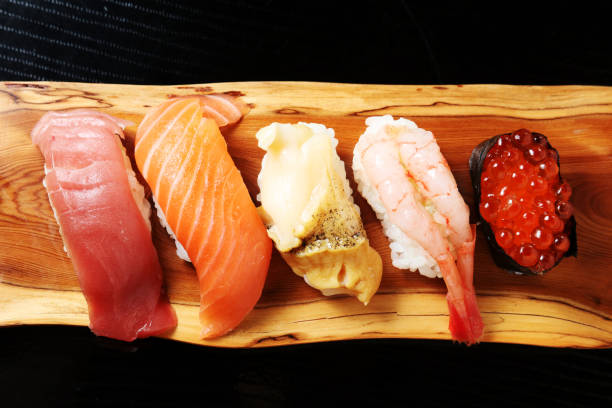 istock Closeup of mixed sushi rolls on a plate 664280264