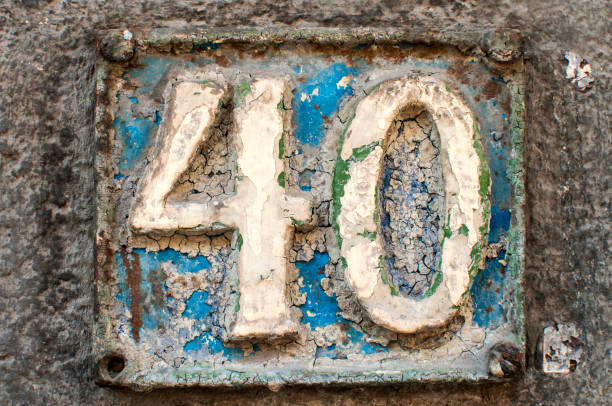 istock Old retro cast iron plate number 40 664283894