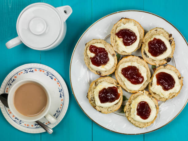 istock Scones With Clotted Cream and Strawberry Jam With Tea 664284234