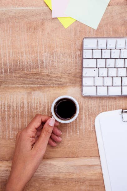 istock Businesswoman holding coffee cup 664291966