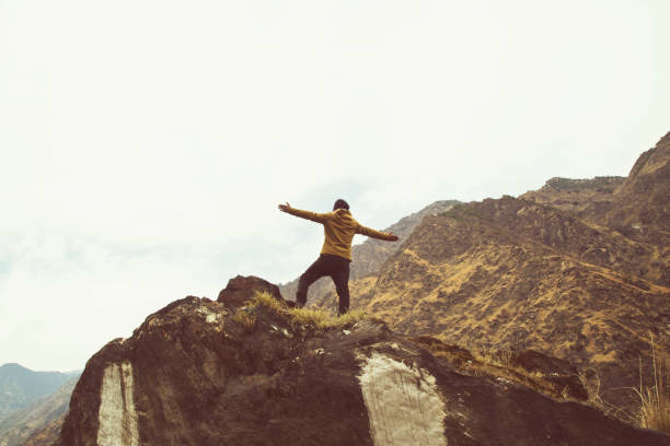 istock Man with arms outstretched on Himalayan mountain 664295208