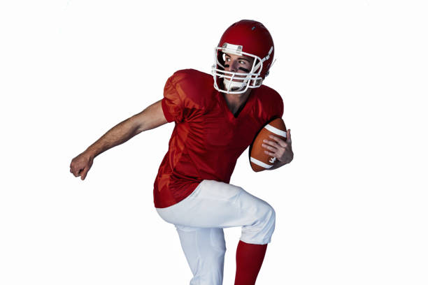 istock Rugby player holding the ball while lifting leg 664296724