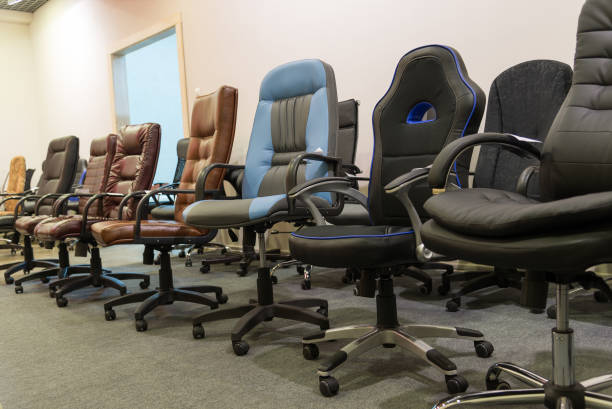 istock Office chairs in store standing in a row 664297138