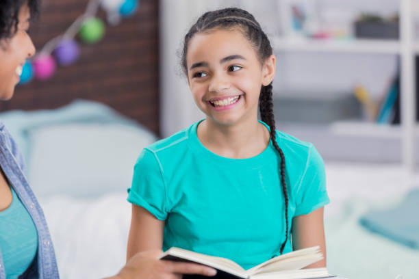 istock Preteen girl works on homework assignment 664304494