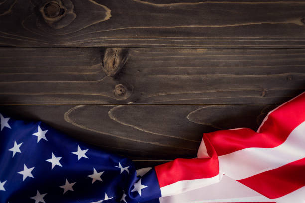 istock USA flag on wooden wall background and texture with space 664305250