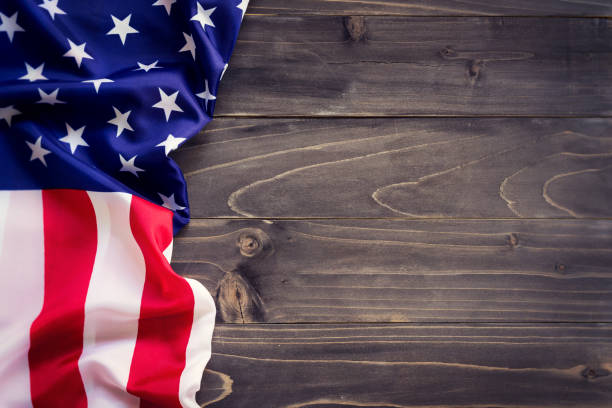istock USA flag on wooden wall background and texture with space 664307362
