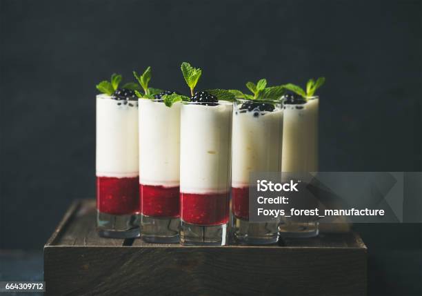 Dessert In Glass With Blackberries And Mint Over Dark Background Stock Photo - Download Image Now