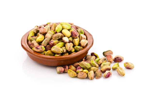 istock Pistachios in a brown bowl 664313818